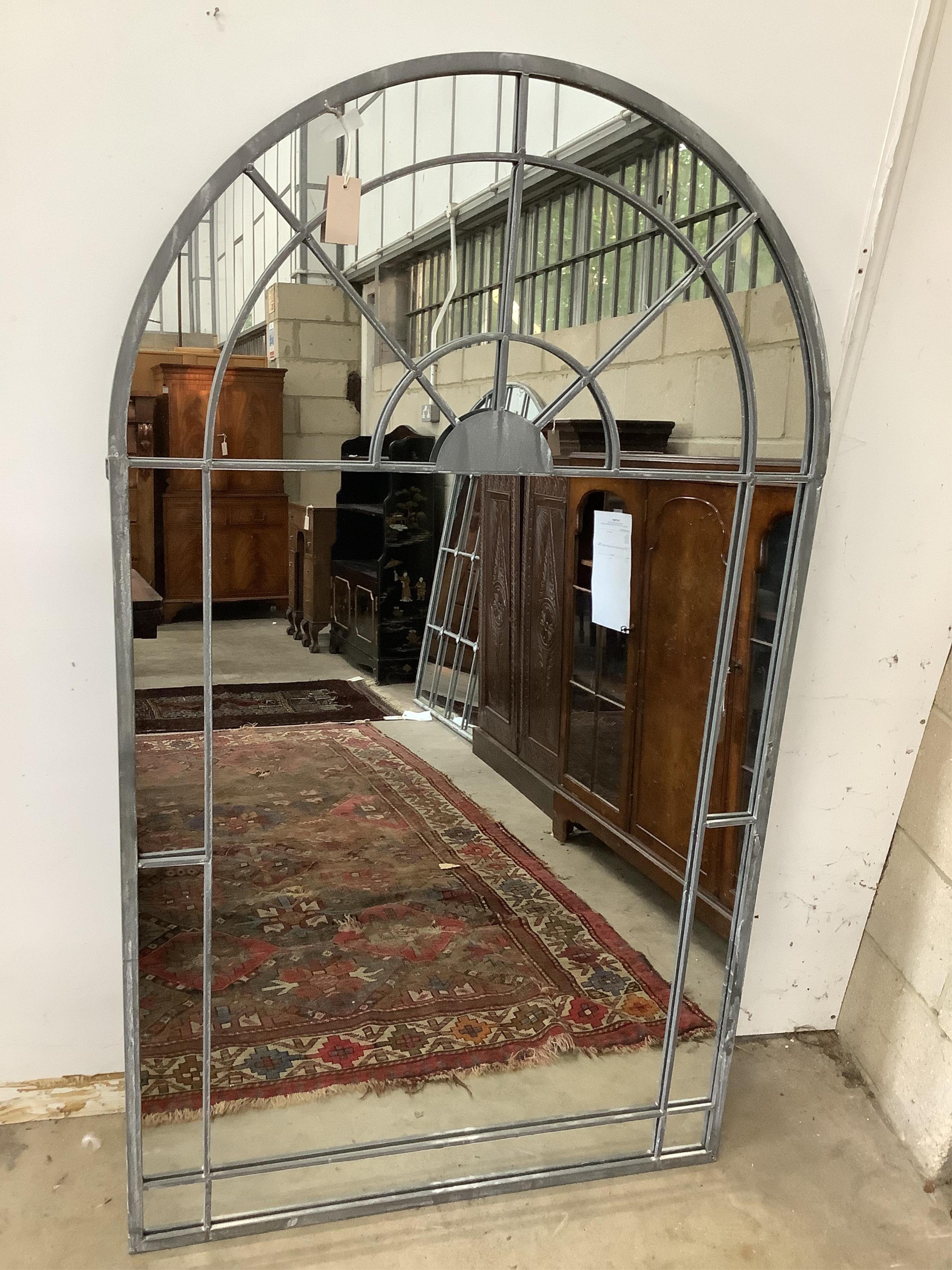 A modern metal framed arched wall mirror, width 90cm, height 155cm. Condition - good, oxidised intentionally